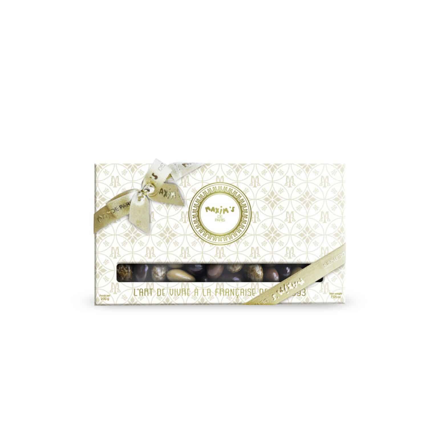 “Maxim’s white and gold luxury gift box with four compartments of assorted chocolate-coated almonds”