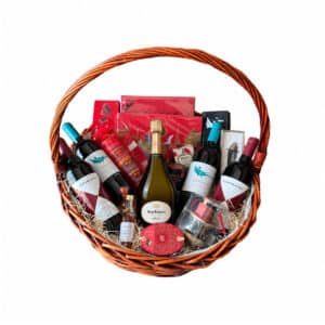 Gift basket with Dom Ruinart 2013, two GAJA Rossj-Bass bottles, two Ca’Marcanda bottles and Maxim’s chocolates