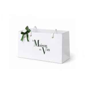 Large white La Maison du Vin gift bag with green logo, white rope handles and green ribbon decoration