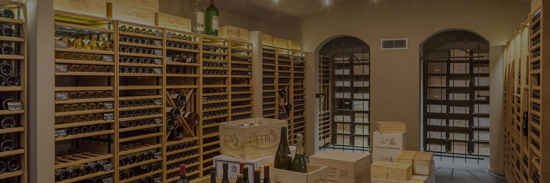 EuroCave Modulothèque solid oak wine racks in a traditional wine cellar