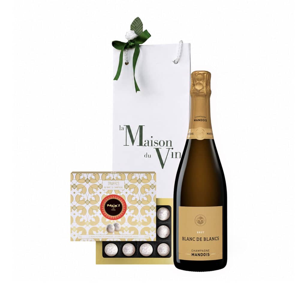 White luxury gift bag with one bottle of Mandois Blanc de Blancs Champagne and maxims de paris champagne truffle