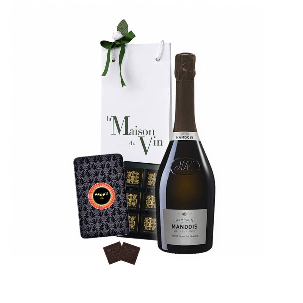 White luxury gift bag with one bottle of Mandois Cuvée Victor Blanc de Blancs Champagne and Maxim’s Dark Chocolate Squares