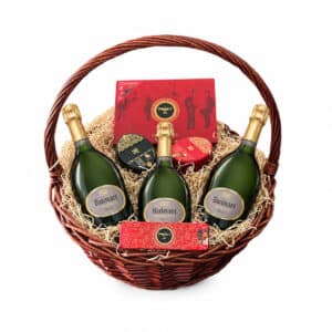 Ruinart Grand Trio gift basket with three Ruinart Brut bottles and Maxim’s chocolates