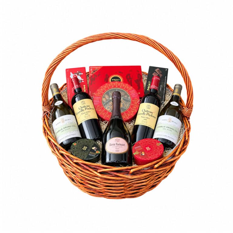 Luxury wicker basket with Dom Ruinart Rosé 2009, two Chablis Les Clos bottles, two Léoville Poyferré bottles and Maxim’s chocolates